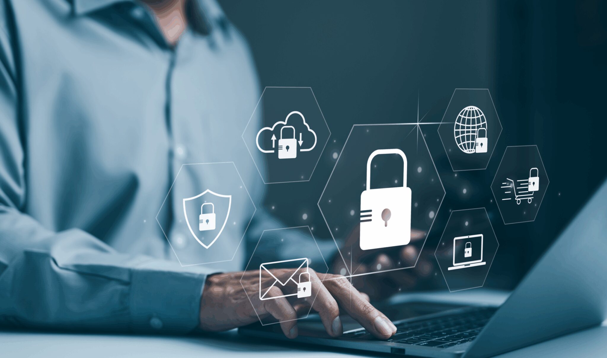 Person using laptop with security icons overlay.