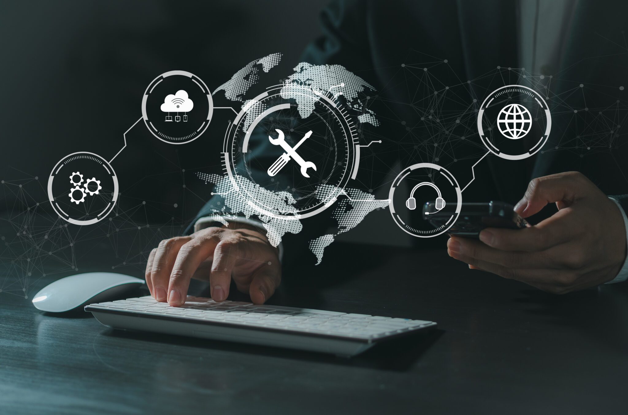 Person using keyboard and smartphone, digital icons.