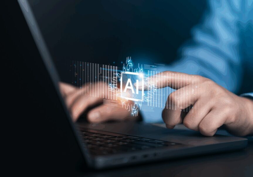 Person interacting with AI on laptop.