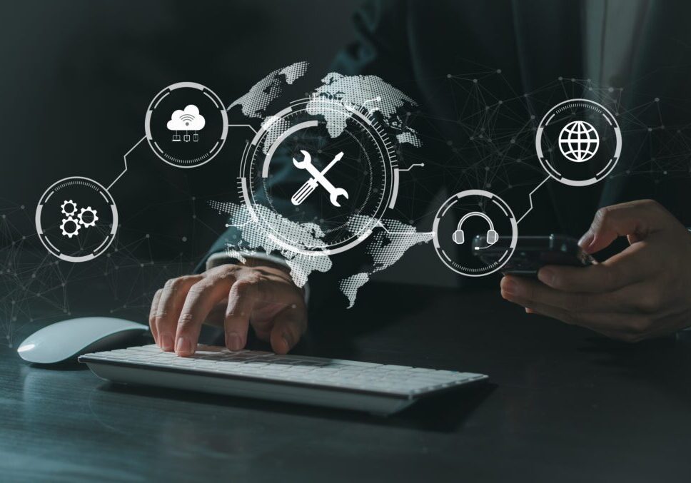 Person using keyboard and smartphone, digital icons.
